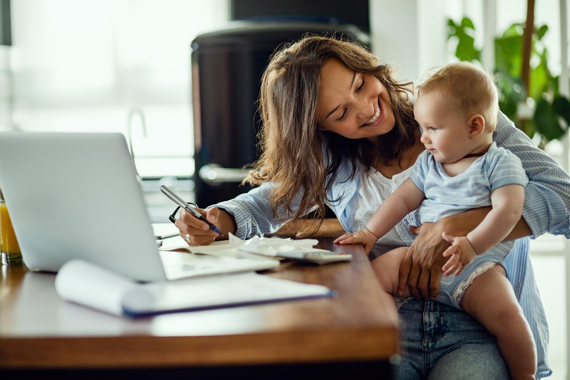 Mother With Child in Lap at Table Image